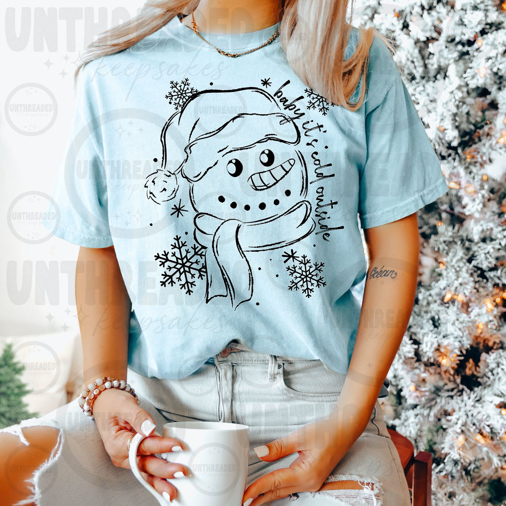 Light blue shirt with black snowman Baby It's Cold Outside design