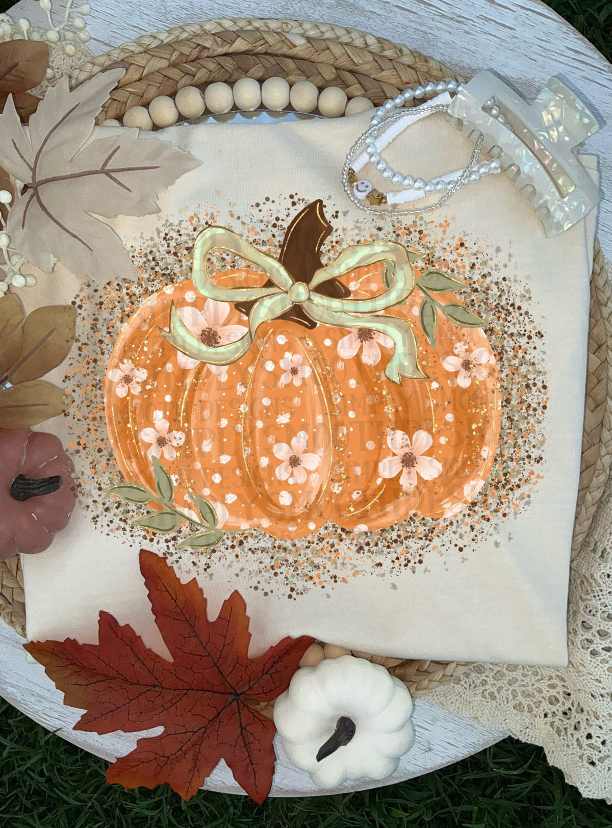 Natural cream T-shirt with floral pumpkin and sage green bow graphic