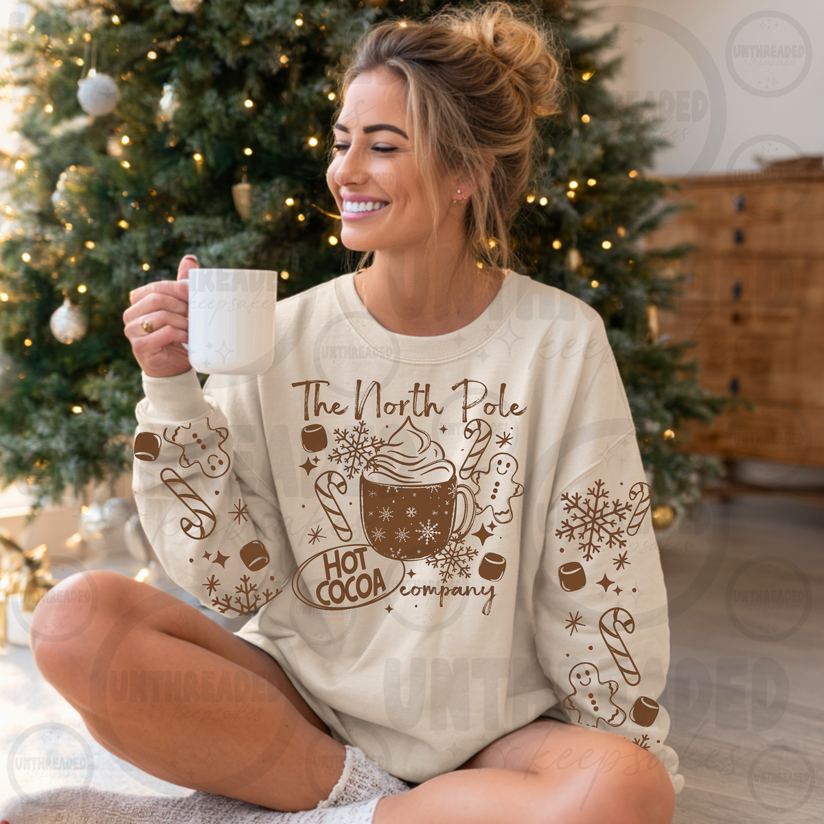 North Pole Hot Cocoa Company Christmas crewneck on cream
