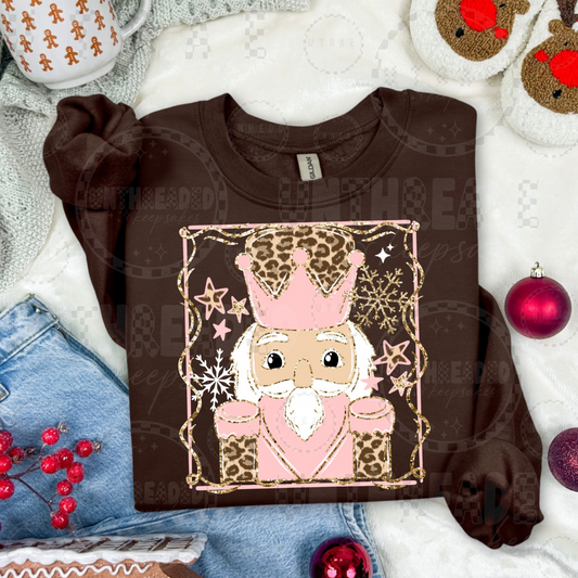 Brown crewneck with pink leopard nutcracker light skin tone design