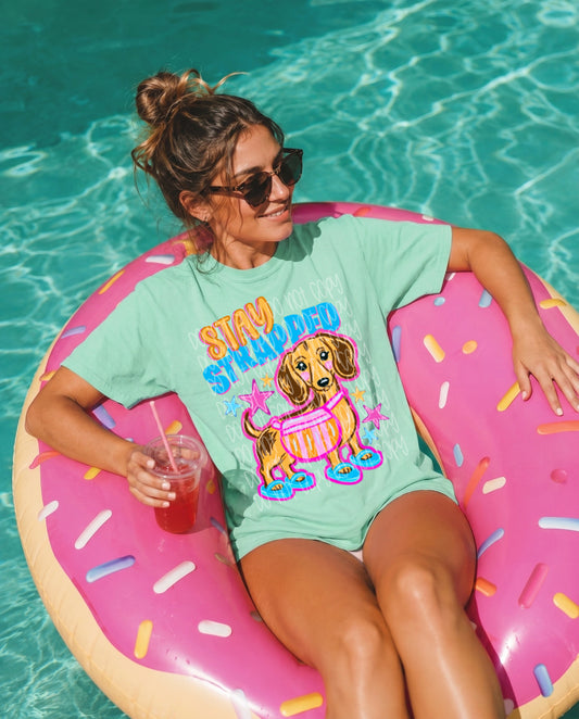Stay Strapped Wiener Dog Graphic T-Shirt | Funny Dachshund Tee | Cute Dog Lover Unisex Shirt | Humorous Graphic Tee