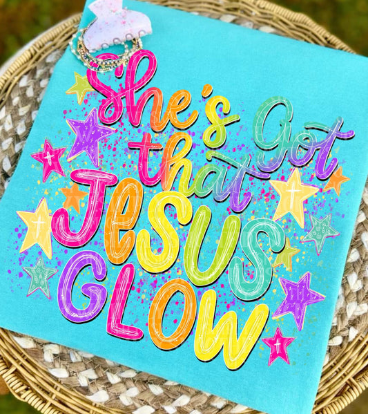 She's Got That Jesus Glow Graphic T-Shirt | Christian Faith Tee | Inspirational Women's Church Shirt | Unisex Religious Apparel