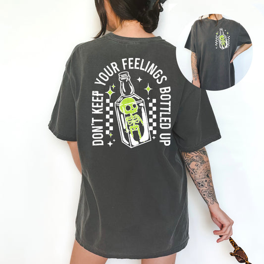 Don't Keep Your Feelings Bottled Up Skeleton Graphic Tee | Halloween Comfort Colors Shirt | Spooky Pocket & Back Print Tee | Skeleton Bottle Shirt | Funny Gothic Graphic Tee 💀🧪🖤