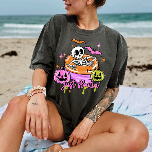 Just Floating Spooky Summer Graphic T-Shirt | Cute Halloween Summer Tee | Ghost Pool Float Unisex Shirt | Spooky Season Apparel