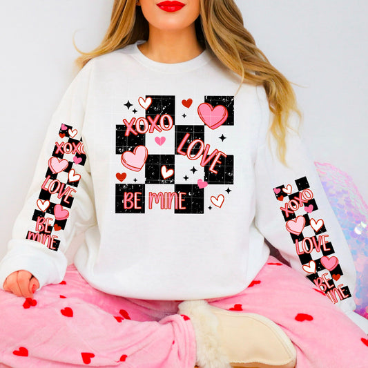 XOXO Love Be Mine Valentine Sweatshirt with matching sleeve art for extra Valentine’s Day charm!– Hearts & Checkerboard Design with Sleeve Art | Cute Valentine Crewneck