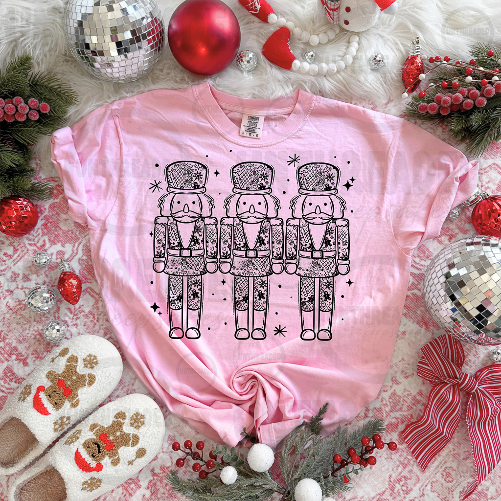 Pink Christmas nutcracker trio graphic tee