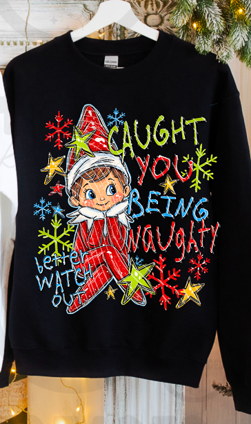 Black crewneck mockup with Caught You Being Naughty elf graphic