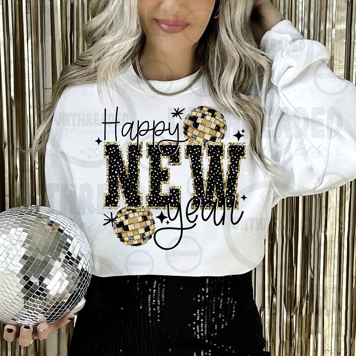 White Happy New Year crewneck with gold disco balls and black and gold lettering