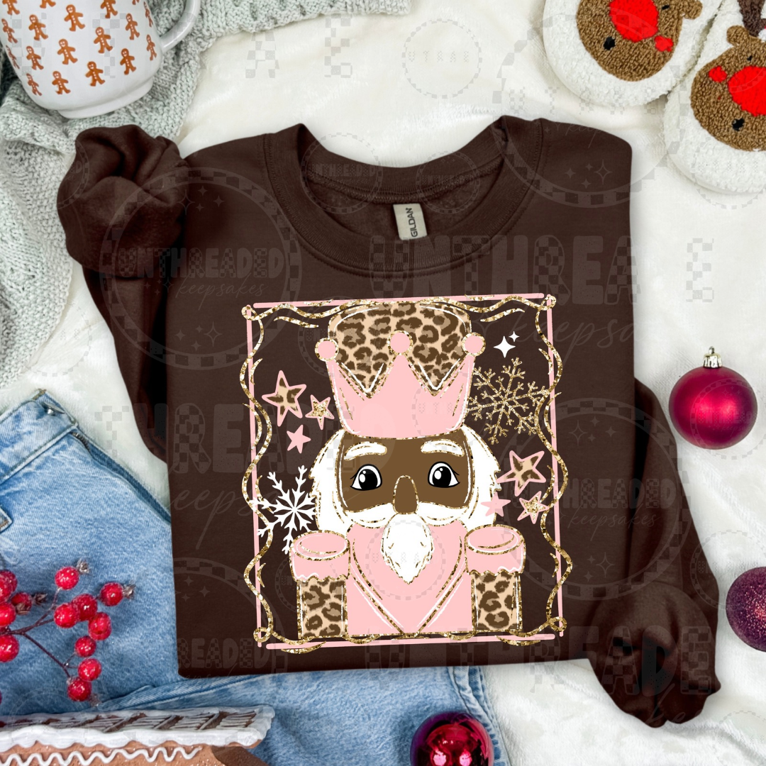 Brown crewneck with pink leopard nutcracker deep skin tone design
