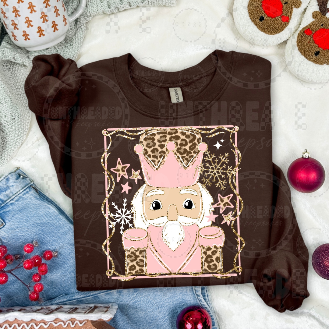 Brown crewneck with pink leopard nutcracker light skin tone design