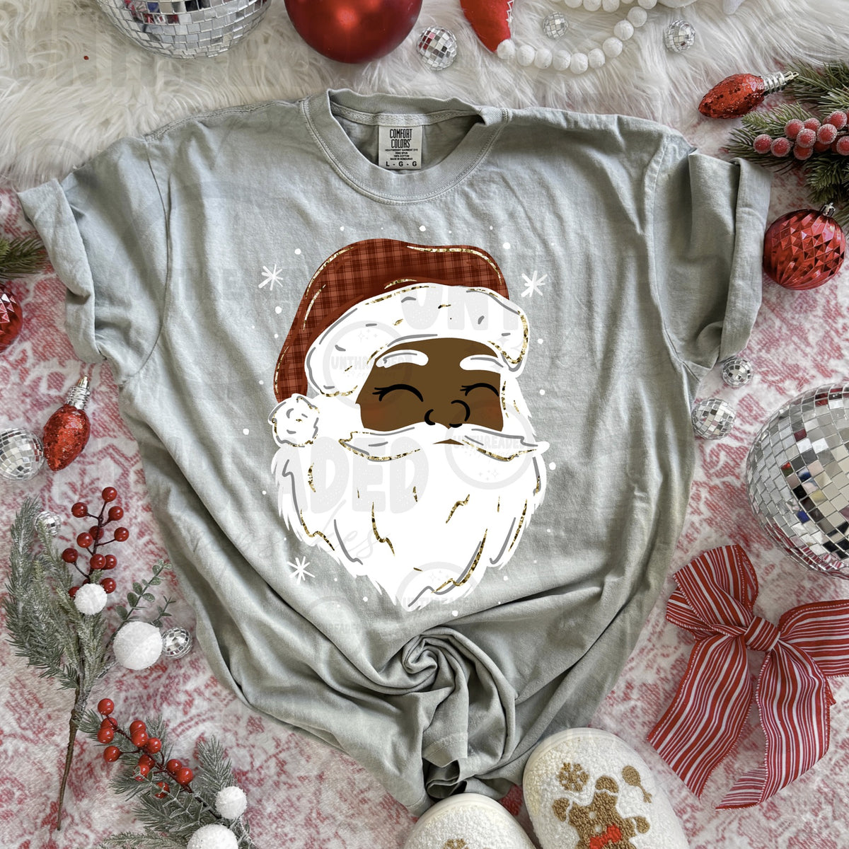 Light gray T-shirt with smiling Santa graphic, deep skin tone, plaid hat and white beard