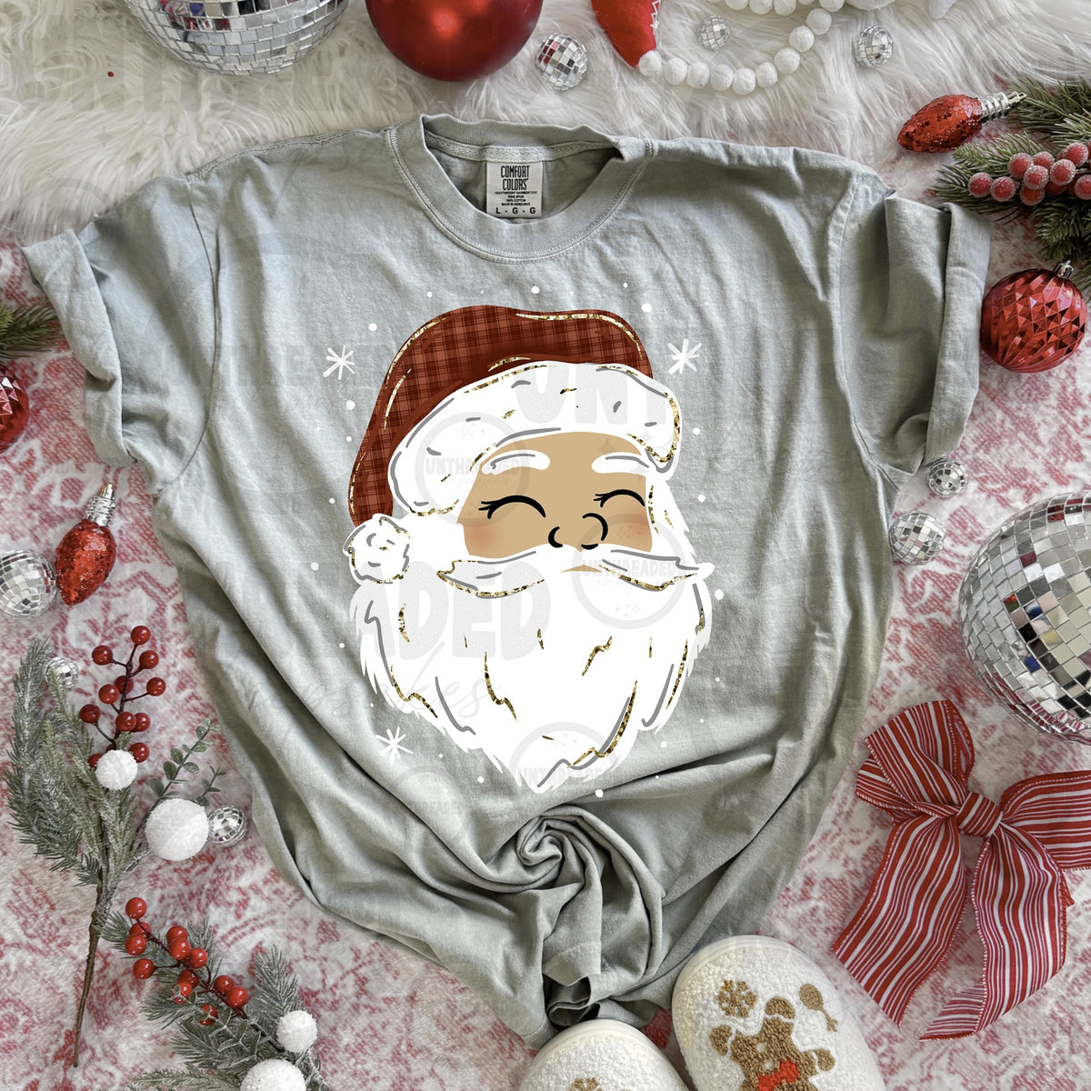 Light gray T-shirt with smiling Santa graphic, light skin tone, plaid hat and white beard