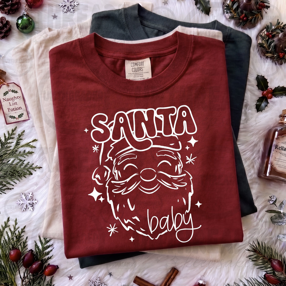 Santa Baby White Outline Christmas Graphic T-Shirt in Burgundy — product mockup